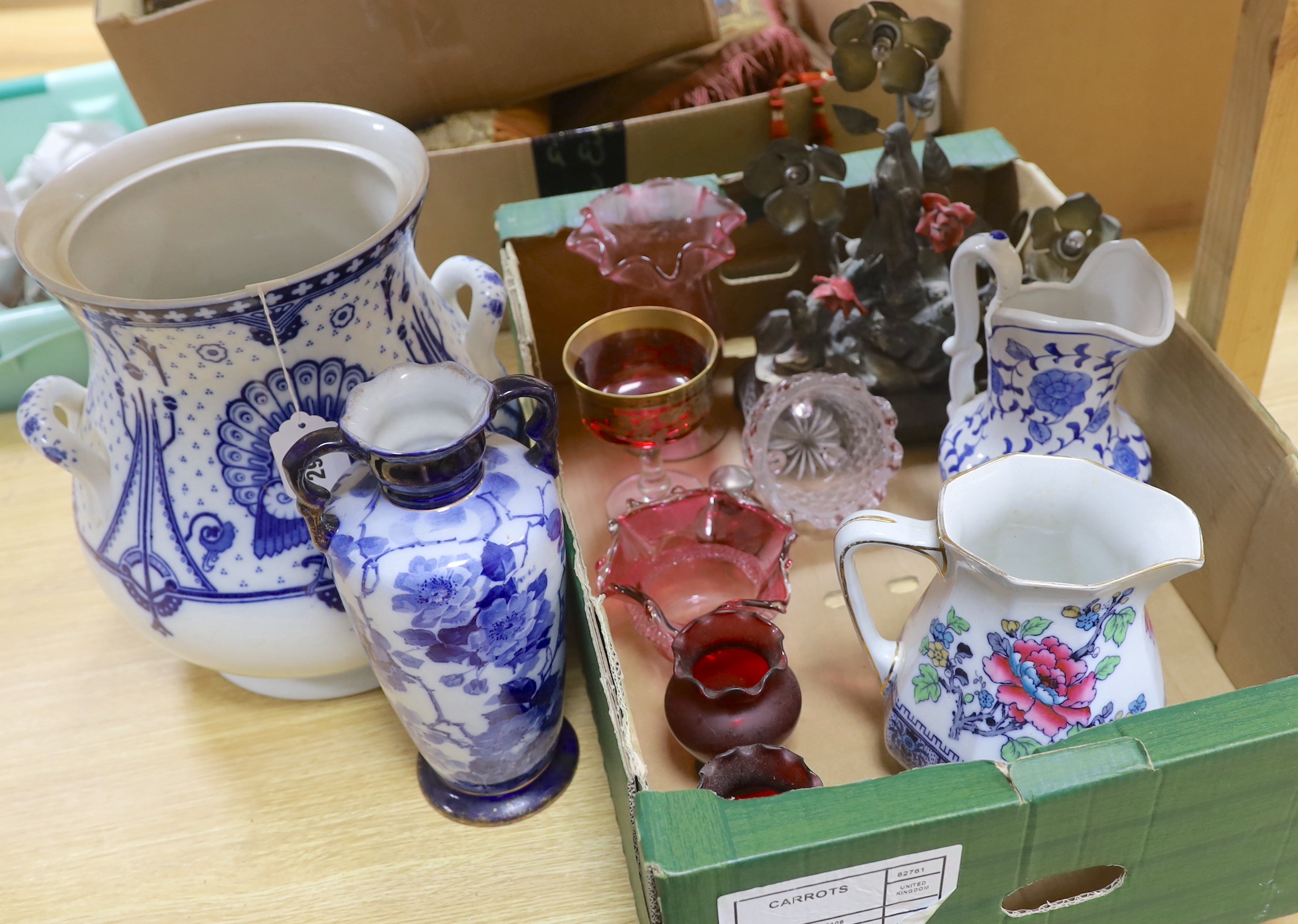 A large Arts and Crafts style two handled blue and white pot, a vase, two jugs, a quantity coloured glass and a table lamp